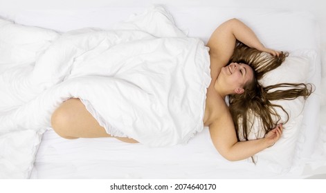 Happy Excited Confident, Plump, Sexy, Plus Size, Chubby Woman With Dark Long Hair In Bed. Brunette Cute Plus Size Girl Enjoying Life And Nice Day, Relaxing In Bedroom, Copy Space