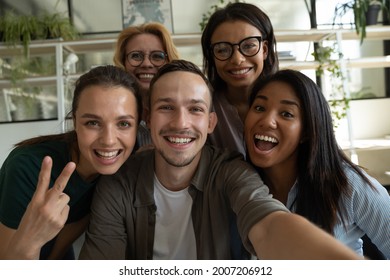 Happy Excited Diverse Business Team, Mixed Race Employees Of Different Generations Taking Office Selfie, Holding Mobile Phone, Looking At Camera, Smiling. Head Shot Portrait, Screen View