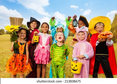 Happy Excited Kids In Halloween Costumes