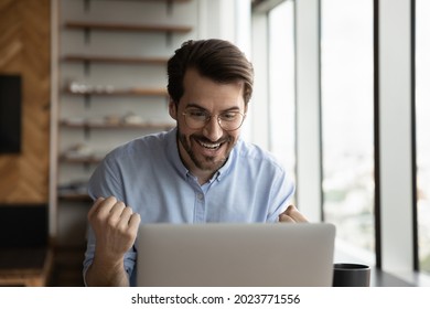 Happy Excited Laptop User Getting Amazing Good News, Looking At Screen, Making Yes Winner Gesture, Celebrating Job Result, Work Achieve, Success, Reward. Surprised Overjoyed Employee Getting Promotion