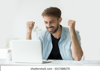 Happy excited man celebrating online win success achievement result looking at laptop screen, successful entrepreneur excited by good news in email, motivated by business win or new job opportunity - Powered by Shutterstock