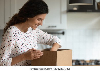 Happy Excited Online Shop Customer Receiving Order, Unpacking Parcel, Opening Carton Box, Looking Inside Package, Getting Surprise Gift, Laughing And Smiling. Delivery, Courier Service, Mail Concept