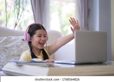Happy Excited Pre Teen Studying on Computer Notebook, Stay at Home Stay Safe.  