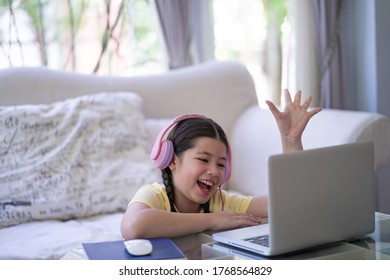 Happy Excited Pre Teen Studying On Computer Notebook, Stay At Home Stay Safe.  