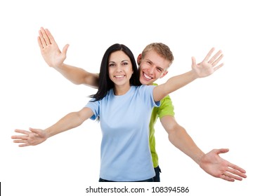 Happy excited smiling friends man and woman holding open palm at you, young people students girl and guy show welcome freedom gesture isolated on white background