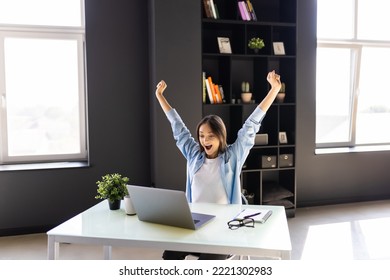 Happy Excited Woman At Home Workstation Triumphing With Raised Hands