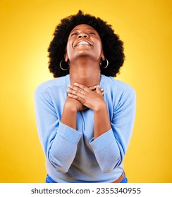 Happy, excited and a young woman in studio with good news, hope and gratitude. Black person or winner on a yellow background for announcement, hands on chest and grateful for luck or self love