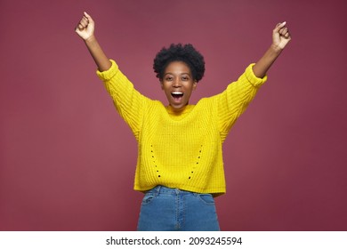 Happy exited african american girl champion rejoice success win, feel euphoric with achievement, shouting, raising hands - Shutterstock ID 2093245594