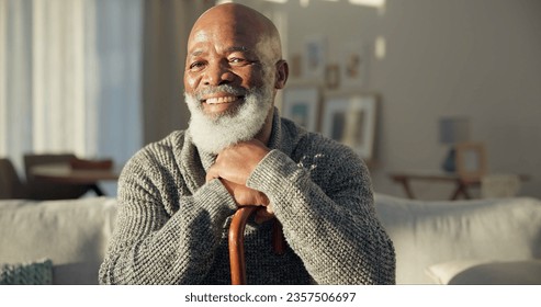 Happy, face and a black man with a cane on the sofa for support, medical help and retirement. Smile, house and portrait of a senior African person on the living room couch with a stick for walking - Powered by Shutterstock