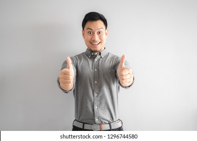 Happy Face Of Funny Good Looking Asian Man With Hand Sign Pointing.