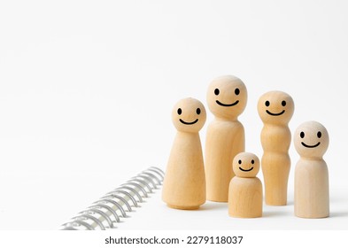 Happy face on wooden figures of family members. Emotion and satisfaction family concepts. - Powered by Shutterstock