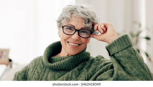 Happy, face and senior woman on sofa to relax in home or grandma laughing with happiness and freedom in retirement. Portrait, elderly person and smile in living room, house or thinking of good memory - Powered by Shutterstock