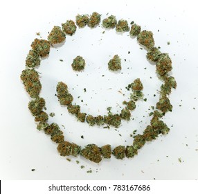 A Happy Face Symbol Made With Real Marijuana On White.