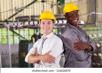 Happy Factory Manager And Worker Portrait