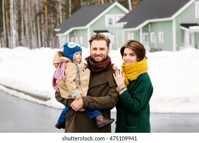 Happy Family Against A Country House