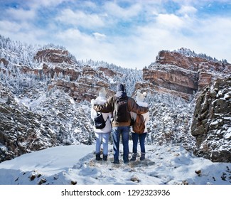 Happy Family With Arms Around Each Other Enjoying Beautiful  Mountain View On Winter  Hiking Trip. Glenwood Springs, Colorado, USA.