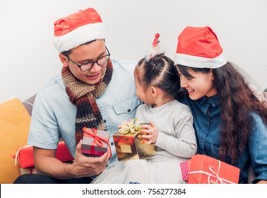 Happy Family Asia Family Wear Santa Claus Hat Exchange Christmas Gift Box At House Xmas Party,Holiday Celebrating Festive Concept,vintage Filter