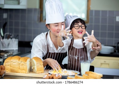 Happy Family Asian Woman Young Mother With Son Boy Cooking Healthy Salad For The First Time. First Lesson And Healthy Lifestyle Concept.