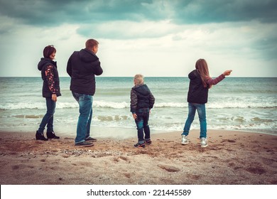 Happy Family Autumn At Beach 