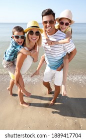 Happy Family At Beach On Sunny Summer Day