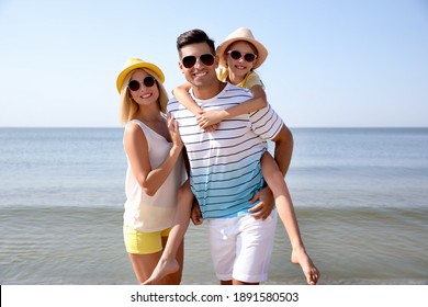 Happy Family At Beach On Sunny Summer Day