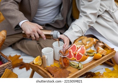 Happy Family, Beautiful Couple On A Fall Picnic In The Park, Surprise Date. Cozy Autumn Vibes. Spending Quality Time Together, Having Fun