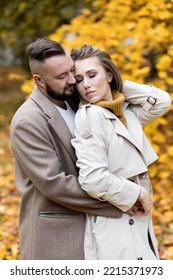 Happy Family, Beautiful Couple On A Fall Picnic In The Park, Surprise Date. Cozy Autumn Vibes, Bright Colours. Spending Quality Time Together