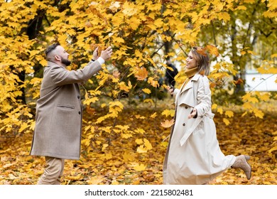 Happy Family, Beautiful Couple On A Fall Picnic In The Park, Surprise Date. Cozy Autumn Vibes, Bright Colours. Spending Quality Time Together