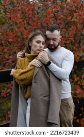 Happy Family, Beautiful Couple On A Fall Picnic In The Park, Surprise Date. Cozy Autumn Vibes, Bright Colours. Spending Quality Time Together