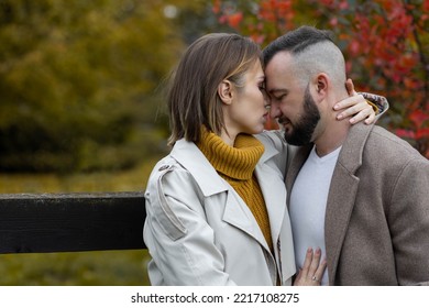 Happy Family, Beautiful Couple On A Fall Picnic In The Park, Surprise Date. Cozy Autumn Vibes, Bright Colours. Spending Quality Time Together