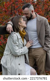 Happy Family, Beautiful Couple On A Fall Picnic In The Park, Surprise Date. Cozy Autumn Vibes, Bright Colours. Spending Quality Time Together