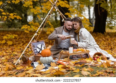 Happy Family, Beautiful Couple On A Fall Picnic In The Park, Surprise Date. Cozy Autumn Vibes. Spending Quality Time Together, Having Fun