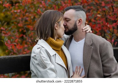 Happy Family, Beautiful Couple On A Fall Picnic In The Park, Surprise Date. Cozy Autumn Vibes, Bright Colours. Spending Quality Time Together