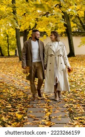 Happy Family, Beautiful Couple On A Fall Picnic In The Park, Surprise Date. Cozy Autumn Vibes, Bright Colours. Spending Quality Time Together