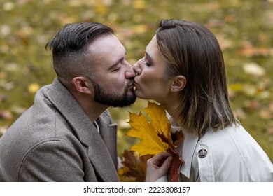 Happy Family, Beautiful Couple On A Fall Picnic In The Park, Surprise Date. Cozy Autumn Vibes, Bright Colours. Spending Quality Time Together