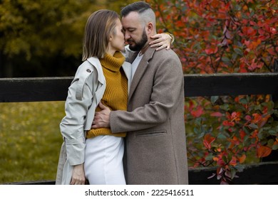 Happy Family, Beautiful Couple On A Fall Picnic In The Park, Surprise Date. Cozy Autumn Vibes, Bright Colours. Spending Quality Time Together