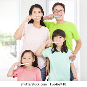 Happy Family Brushing Her Teeth