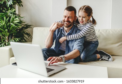 happy family a businessman father working at computer and his child daughter  at home
 - Powered by Shutterstock