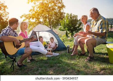 Happy Family Camping In The Park
