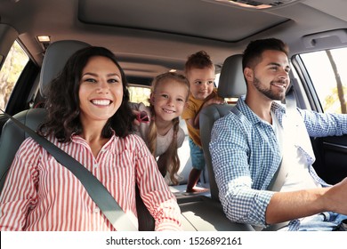 Happy Family In Car On Road Trip