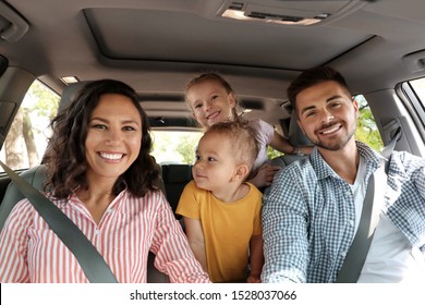 Happy Family In Car On Road Trip