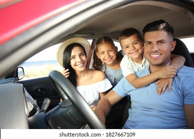 Happy Family In Car On Road Trip