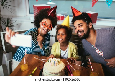 Happy Family Celebrating A Birthday Together At Home Make Selfie