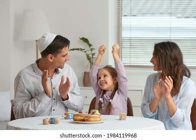 Happy Family Celebrating Hannukah At Home