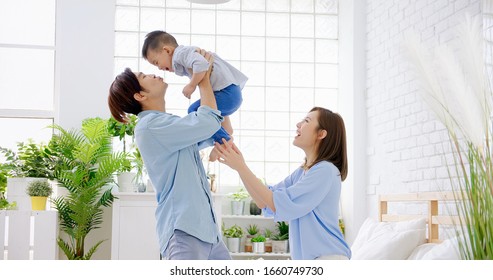 happy family with child boy play and kiss at home - Shutterstock ID 1660749730
