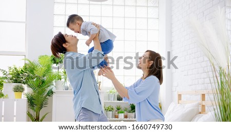 happy family with child boy play and kiss at home