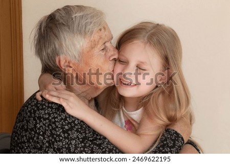 Similar – Image, Stock Photo Grandma cuddles up with her grandson