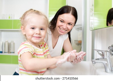 Happy Family - Child And Mother Washing Hands With Soap In Bathroom