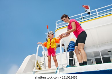 Happy Family With Child On Yacht. Snorkeling Travel.