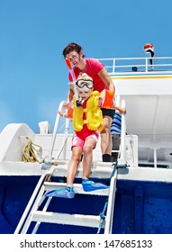 Happy Family With Child On Yacht. Snorkeling Travel.